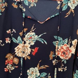 Brand new women’s floral blouse with bell sleeves